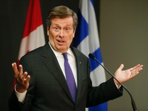 Mayor John Tory explains to the media at a Toronto City Hall press conference his  preference for the hybrid plan for the future of the Gardiner Expressway East in downtown Toronto May 12, 2015. (Stan Behal/Toronto Sun)