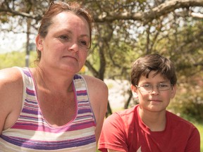 Mary Katherine Keown/The Sudbury Star
Laurie Zuliani and her son, Evan, helped out at the scene of a fatal accident on MR 55 on Friday evening.