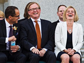 (From left) Minister of Finance Joe Ceci, Minister of Education and Minister of Culture and Tourism David Eggen and Premier Rachel Notley are seen during the swearing-in ceremony for the NDP government cabinet at the Alberta Legislature Building in Edmonton, Alta. on Sunday, May 24, 2015. Codie McLachlan/Edmonton Sun/Postmedia Network