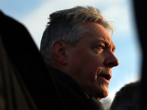 The Democratic Unionist Party's Peter Robinson speaks to the press outside Stormont House in Belfast, on Dec. 12, 2014. (REUTERS/Cathal McNaughton)