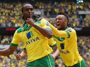 Cameron Jerome celebrates with Nathan Redmond after scoring the first goal for Norwich City. (REUTERS)
