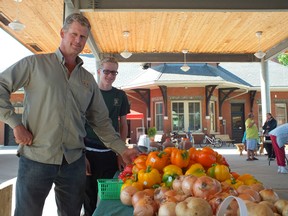 John Zekvled and his son Devyn show off their produce during the first day of the Petrolia Farmer's Market. BRENT BOLES/ POSTMEDIA NETWORK