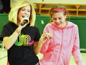 While she sang some of her original songs – such as “I am Somebody” and “Love Crusade” – motivational speaker Sara Westbrook convinced students like Reagan Michiels to get up and dance with her at her UPower Concert May 14 at St. Patrick's School in Kinkora. GALEN SIMMONS/MITCHELL ADVOCATE