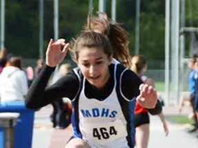 Lindsay Harmer leaps high into the pit during the midget girls triple jump event, where she finished fourth and just out of the medals. MARK DEWAN PHOTO