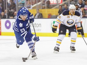 Toronto Maple Leafs' Sam Carrick and Buffalo Sabres' Patrick Kaleta during first period action at the Air Canada Centre in Toronto on Sunday September 28, 2014. (Ernest Doroszuk/Toronto Sun)