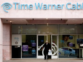 A customer leaves a Time Warner Cable store in Palm Springs, Calif., in this file photo from Jan. 29, 2014.  REUTERS/Sam Mircovich/Files