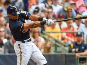 Brewers left fielder Khris Davis hits one of two solo home runs against the Giants during MLB action in Milwaukee on Monday, May 25, 2015. (Benny Sieu/USA TODAY Sports)