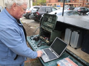 Don Gilroy talks on a Frontenac Amateur Radio Group radio in Glenburnie on Friday. Elliot Ferguson/The Whig-Standard)