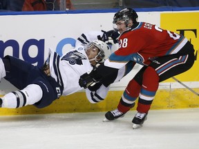 Kelowna Rockets? Joe Gatenby wipes out Rimouski Oceanic?s Anthony Deluca during the second period of their Memorial Cup hockey game at the Colisee Pepsi in Quebec City on Monday night. The Rockets won 7-3. (Reuters)