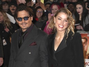 Johnny Depp and his wife Amber Heard .
(SMY/WNSEX/LR)