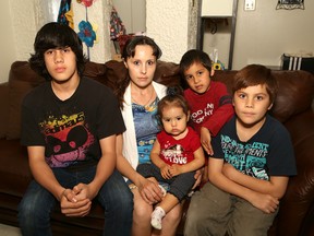 Joanie Leedham, and her children, Joshua, 14,  Emma, 1, Jace, 5, and Jayden 11, are trying to adjust to realty of life without her partner and father to her children, Percy Simon Jr. John Lappa/Sudbury Star/Postmedia Network