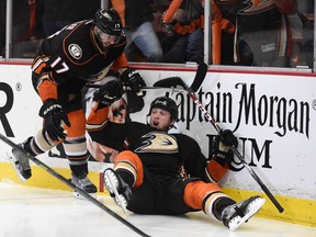 Anaheim Ducks left wing Matt Beleskey is congratulated by center Ryan Kesler for scoring the game-winning goal against the Chicago Blackhawks during the overtime period in Game 5 of the Western Conference Final of the 2015 NHL playoffs at Honda Center on May 25, 2015. (Gary A. Vasquez/USA TODAY Sports)