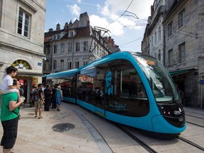 File photo of a tram moving along a track during the inauguration of the tramway of Besancon in eastern France on August 30, 2014. AFP PHOTO / SEBASTIEN BOZON