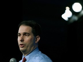 Wisconsin Governor Scott Walker met with Milwaukee city officials and Bucks team president Peter Feigin to discuss a financing deal to pay for the team's proposed $500 million downtown stadium. (REUTERS/Rick Wilking)