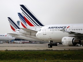 Air France planes are parked on the tarmac at the Charles de Gaulle International Airport. U.S. warplanes were scrambled to escort an Air France passenger jet flying from Paris to New York on Monday, officials said. Flight AF022 landed at JFK airport without incident after being escorted to land by two F-15 fighter jets ordered to accompany the aircraft as a precaution by NORAD, the joint US-Canadian monitoring force. The FBI said in a statement the plane was searched upon landing and the threat had turned out to be false. REUTERS/Jacky Naegelen