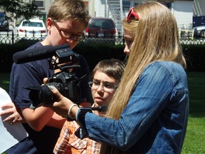 SUBMITTED PHOTO
GetReel Film Camp founder/director Maddy Pilon gives instruction to her film camp students Thomas Lewis (left) and Hudson MacDonald (right).