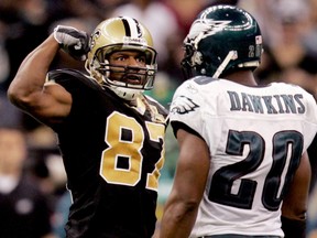 New Orleans Saints wide receiver Joe Horn shows off his muscles to Philadelphia Eagles free safety Brian Dawkins (20) in the fourth quarter after gaining a first down during their NFL football game in New Orleans October 15, 2006. (REUTERS)