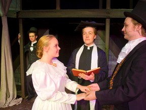 Alicia Bray, plays Jane Eyre in the OKTC production in London. David Carlson is the Vicar, Cole Brocksom plays Edward Rochester while in the background Peter Nye as Richard Mason looks on. (Mike Hensen/The London Free Press)