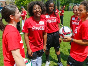 Canadian women’s soccer team members Diana Matheson (left) and Desiree Scott (right) share tips with Special Olympic athletes at U of T yesterday. (Dave Thomas/Toronto Sun)