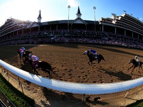 American Pharoah, ridden by Victor Espinoza, seen here winning the Kentucky Derby, is in fine form working out this week. (AFP)