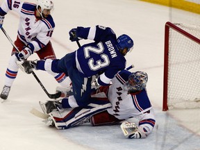 Tampa Bay Lightning right winger J.T. Brown crashes into New York Rangers goalie Henrik Lundqvist during the second period in Game 6 of the Eastern Conference final of the 2015 NHL playoffs at Amalie Arena on May 26, 2015. (Reinhold Matay/USA TODAY Sports)