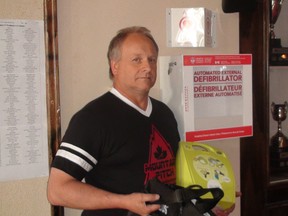 Gord Stevenson, Little Mountain Sportsplex night manager, with the Automated External Defibrillator (AED) which proved to be a real life saver when it helped revive slo-pitch player Bryant Thomson who collapsed during a game on Friday. JIM BENDER/Winnipeg Sun/Postmedia Network