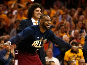 LeBron James (left) and Anderson Varejao react as the Cavaliers cruise to a win over the Hawks in Cleveland last night.