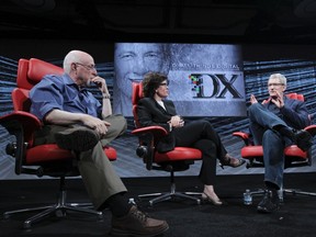 Apple CEO Tim Cook (R) speaks with hosts Walt Mossberg (L) and Kara Swisher (C) at the All Things Digital conference in Rancho Palos Verdes, California in this May 29, 2012 handout file photo. REUTERS/Asa Mathat/All Things Digital/Handout