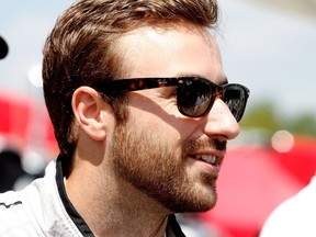James Hinchcliffe is shown on the grid before the IMSA Tudor Series race at Road America on August 10, 2014 in Elkhart Lake, Wisconsin.  Brian Cleary/Getty Images/AFP