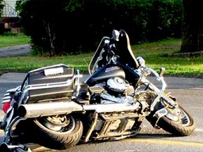 A motorcycle lies on the roadway in front of South Grenville High School in Prescott after a fatal crash Tuesday, May 26. A 51-year-old Spencerville man died in the crash. (Facebook image, Postmedia Network)