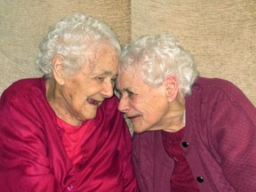 U.K.’s oldest surviving twins Glenys Thomas and her sister Florence Davies are pictured on their 102nd birthday in 2014. The sisters died weeks apart at the age of 103. (Supplied/Postmedia Network)
