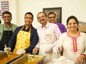 Volunteers with the India Canada Association were filling plates during a fundraising dinner held on the weekend for Nepal earthquake relief. From left, Rakesh Patel, Rushabh Damani, Jayesh Jethwa, Kamlesh Patel and Harsha Jethwa. (Handout)