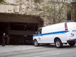 An LA County Coroner's Office van pulls into the rear entrance of the Sunset Marquis hotel where U2 tour manager Dennis Sheehan was pronounced dead in his hotel room, according to local media, in West Hollywood, California May 27, 2015. REUTERS/Patrick T. Fallon