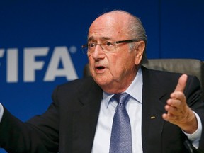 FIFA President Sepp Blatter gestures as he addresses a news conference after a meeting of the FIFA executive committee in Zurich in this March 20, 2015 file picture. (REUTERS/Arnd Wiegmann/Files)