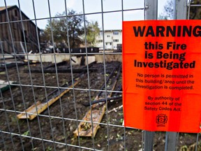 The remnants of a burned out duplex are seen after an overnight fire at 123 Street and 117 Avenue left several people homeless in Edmonton, Alta. on Wednesday, May 27, 2015. Codie McLachlan/Edmonton Sun/