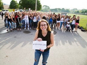 Laura Anderson and other A.B. Lucas Secondary School students defied the school's dress code by wearing sleeveless shirts in London, Ont., May 27, 2015. (DEREK RUTTAN/Postmedia Network)