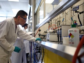Scientists work in laboratories at the grand opening of Gilead Alberta’s first new laboratory building, Gilead Sciences Alberta ULC, 11950-17 Street on Wednesday May 27, 2015 in Edmonton, AB. Trevor Robb/Edmonton Sun