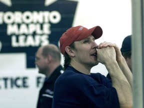 In this 2001 file photo, Steve Thomas watches practice from the behind the glass at Lakeshore Lions Arena in Toronto. (Toronto Sun)