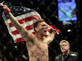 Chris Wiedman celebrates after knocking out Vitor Belfort during their middleweight championship bout during UFC 187 at MGM Grand Garden Arena on May 23, 2015. (Joe Camporeale/USA TODAY Sports)