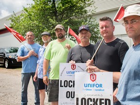 Several Unifor armoured car operators at Garda's Gatineau headquarters Wednesday afternoon protesting Garda's decision to let go of 140 Ottawa employees. Garda closed its Ottawa office on May 25, moving all Ottawa business to the Gatineau location, but not the workers.DANI-ELLE DUBE/OTTAWA SUN