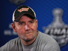 New Jersey Devils coach Peter DeBoer listens to a question during a media conference before Game 4 of the Stanley Cup final June 5, 2012. (REUTERS/Lucy Nicholson)