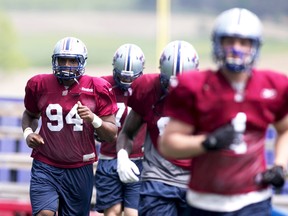 Defensive end Michael Sam (94) does some running on Wednesday during the Alouettes’ training camp in Sherbrooke, Que. (REUTERS)