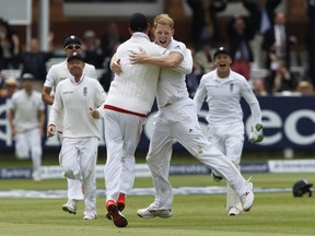 England’s Ben Stokes (right) is congratulated after taking the wicket of New Zealand captain Brendon McCullum during the first of two Tests at Lord’s on Monday. (AFP)
