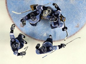 Rimouski Oceanic's players celebrate their victory against the Quebec Remparts during their Memorial Cup hockey game at the Colisee Pepsi on May 27, 2015. (REUTERS/Mathieu Belanger)