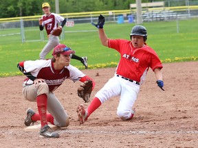 Connor Pelletier, of Elliot Lake, slides into third base as Ryan Barton, of St. Charles Cardinals, attempts to tag him out during NOSSA boys baseball action at the Terry Fox Sports Complex in Sudbury, Ont. on Wednesday May 27, 2015. John Lappa/Sudbury Star/Postmedia Network