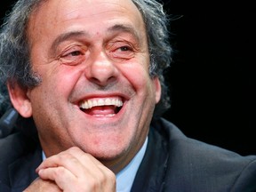 UEFA President Michel Platini laughs during a news conference after a UEFA meeting in Zurich, Switzerland, May 28, 2015. A majority of UEFA's member associations will vote for Jordan's Prince Ali bin Al Hussein to succeed Sepp Blatter as the next FIFA president, Platini said on Thursday. (REUTERS/Ruben Sprich)