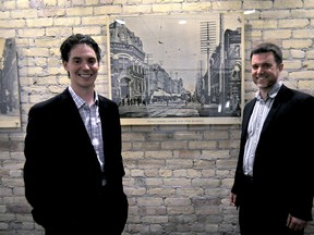 David Brebner (left) and Paul Dugsin, managing partners of Magnus Associates, stand next to an old photo of Dundas Street inside their new office space in the renovated Century Building May 27, 2015. CHRIS MONTANINI\LONDONER\POSTMEDIANETWORK