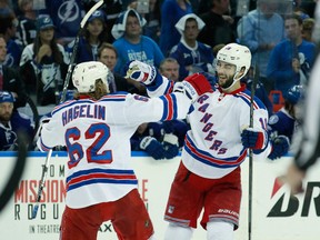 New York Rangers centre Derick Brassard (16) celebrates his empty-net goal with New York Rangers left wing Carl Hagelin (62) during the third period of Game 6 of the Eastern Conference Final of the 2015 Stanley Cup Playoffs at Amalie Arena. (Kim Klement-USA TODAY Sports)