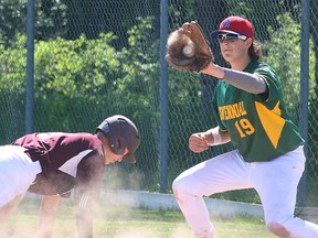 Gavin Ronan of PECI dives back to the bag, guarded by Centennial first baseman Brady Crowe during the BQ baseball final Wednesday in Wellington. (Bruce Bell/The Intelligencer)