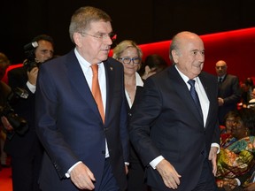 FIFA president Sepp Blatter (right) arrives with International Olympic Committee president Thomas Bach for the opening ceremony of the 65th FIFA Congress in Zurich on May 28, 2015. (AFP PHOTO/FABRICE COFFRINI)